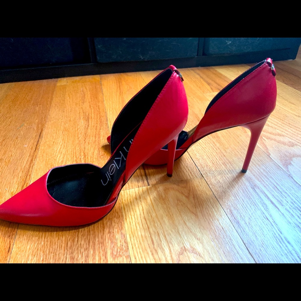 Once-used red Calvin Klein pumps.  Size 9.5
